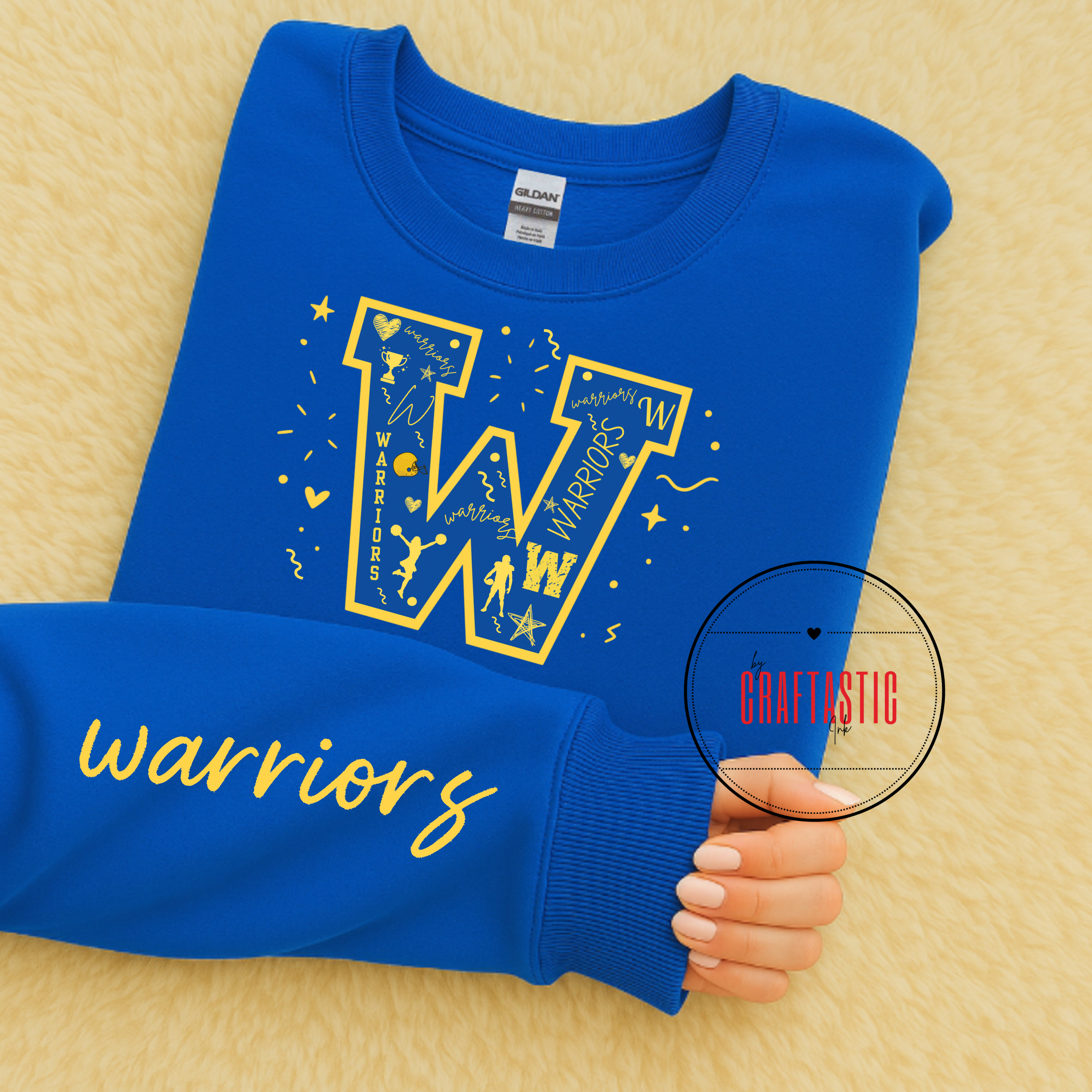 Blue Warriors varsity letter “W” sweatshirt with yellow graphics and matching sleeve print.